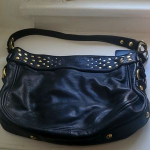 Coach purse black with gold metal design